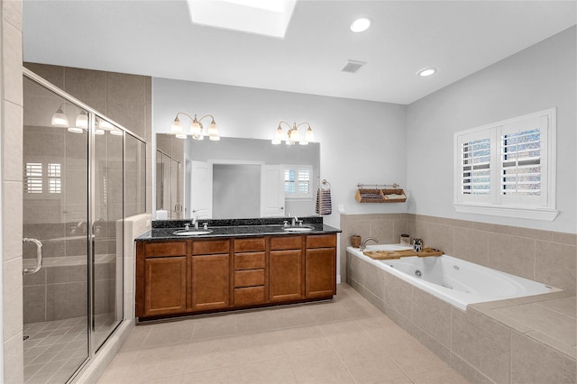 2043 W 14th 1/2 St, Houston, TX 77008 - bathroom featuring a jetted tub, double vanity, a stall shower, tile patterned floors, and plenty of natural light