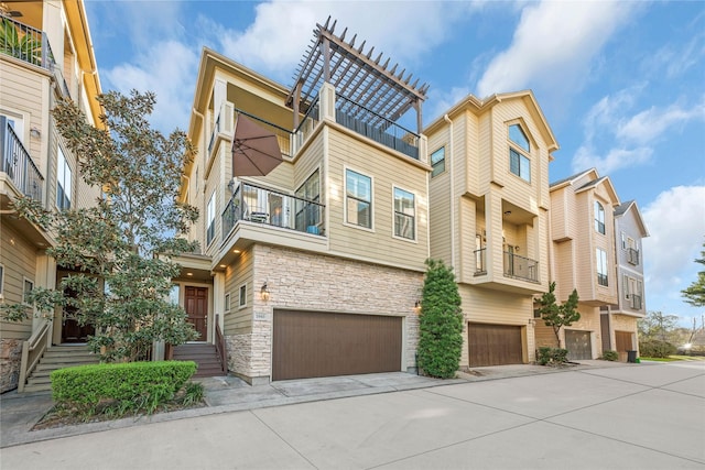 2043 W 14th 1/2 St, Houston, TX 77008 - view of building exterior featuring an attached garage and driveway