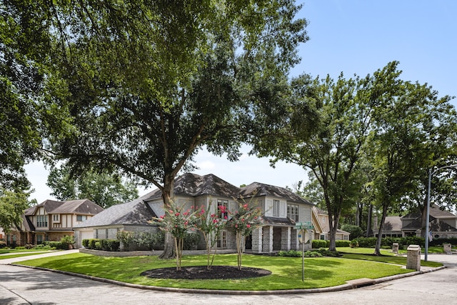 3503 Arbor Terrace Ct, Spring, TX 77388 - view of front of house with a front lawn, concrete driveway, a residential view, an attached garage, and stone siding