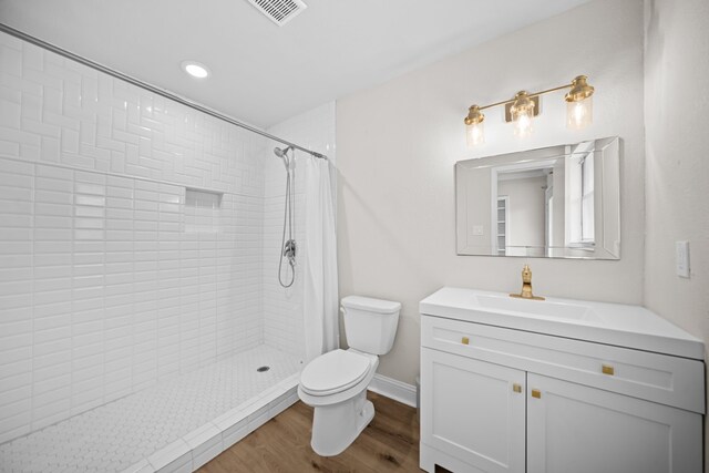 3503 Arbor Terrace Ct, Spring, TX 77388 - bathroom featuring vanity, a tile shower, wood finished floors, and recessed lighting