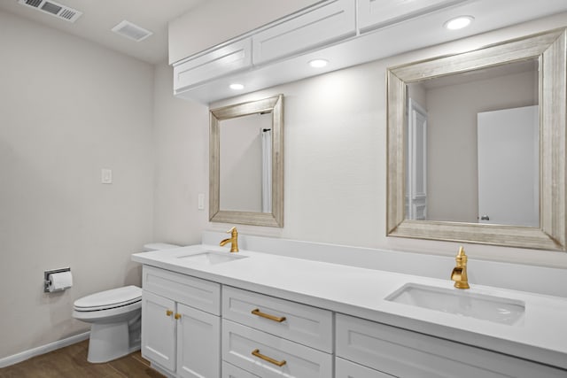 3503 Arbor Terrace Ct, Spring, TX 77388 - bathroom with wood finished floors, double vanity, and recessed lighting