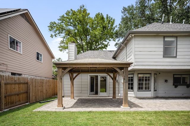 3503 Arbor Terrace Ct, Spring, TX 77388 - back of house with roof with shingles, a chimney, a gazebo, and a patio