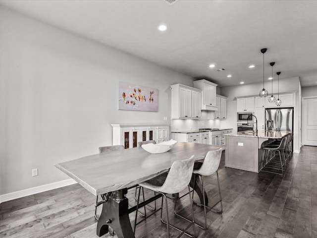3723 Kerr Commons Ln, Houston, TX 77059 - dining area featuring recessed lighting and dark wood-style flooring