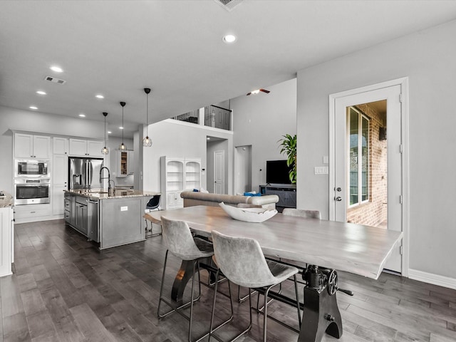 3723 Kerr Commons Ln, Houston, TX 77059 - dining room featuring dark wood-type flooring and recessed lighting