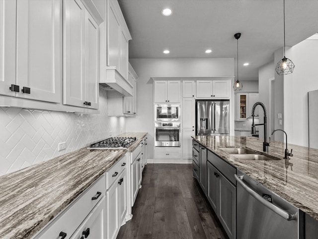 3723 Kerr Commons Ln, Houston, TX 77059 - kitchen with appliances with stainless steel finishes, white cabinets, light stone counters, backsplash, and recessed lighting