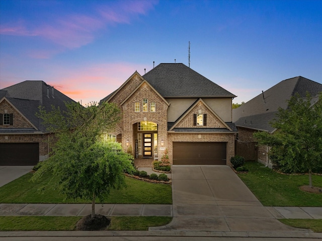 3723 Kerr Commons Ln, Houston, TX 77059 - french country home featuring driveway, a front lawn, brick siding, and roof with shingles