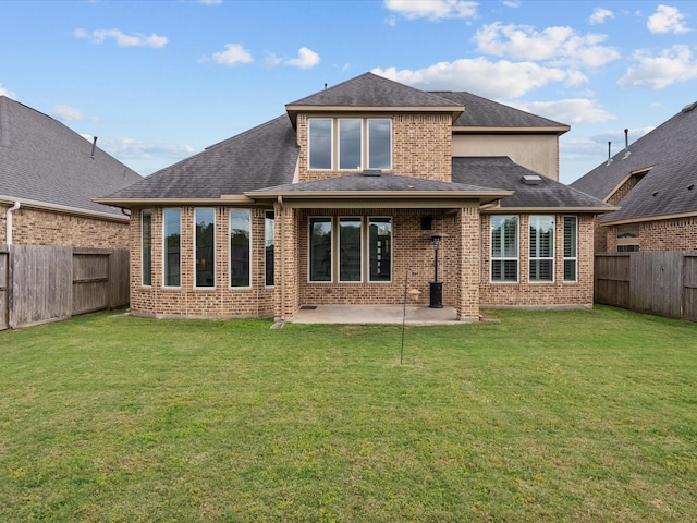 3723 Kerr Commons Ln, Houston, TX 77059 - back of property with brick siding, a fenced backyard, a patio area, and a shingled roof