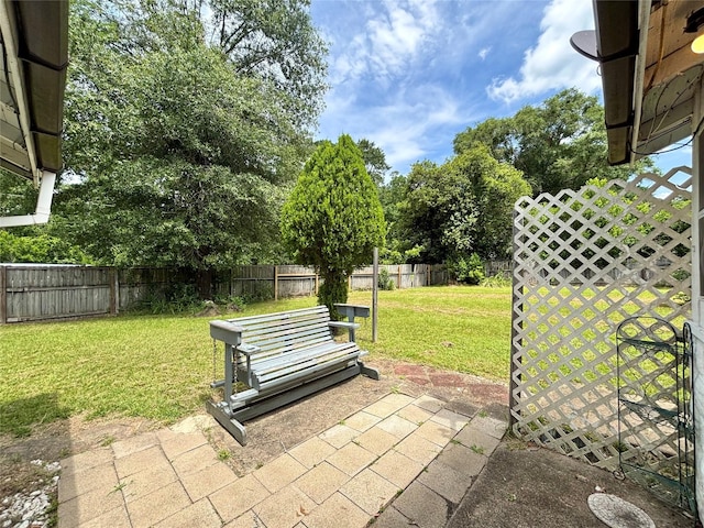 1410 W Pavillion St, Woodville, TX 75979 - fenced backyard with a patio