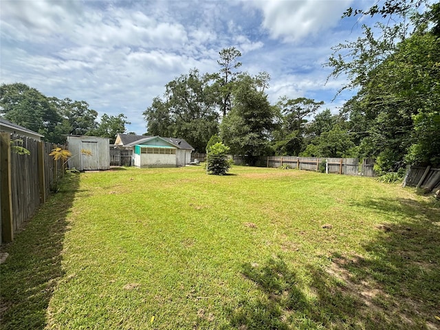 1410 W Pavillion St, Woodville, TX 75979 - fenced backyard featuring a shed