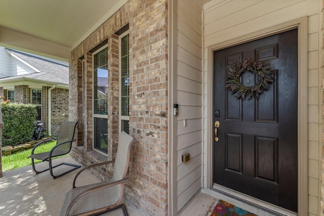 23707 Pennington Hills Dr, Spring, TX 77389 - entrance to property featuring covered porch and brick siding
