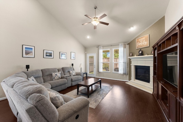 23707 Pennington Hills Dr, Spring, TX 77389 - living area with a ceiling fan, dark wood-style flooring, recessed lighting, a glass covered fireplace, and high vaulted ceiling