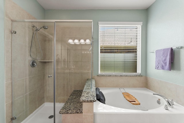 23707 Pennington Hills Dr, Spring, TX 77389 - full bathroom featuring a bath and a shower stall