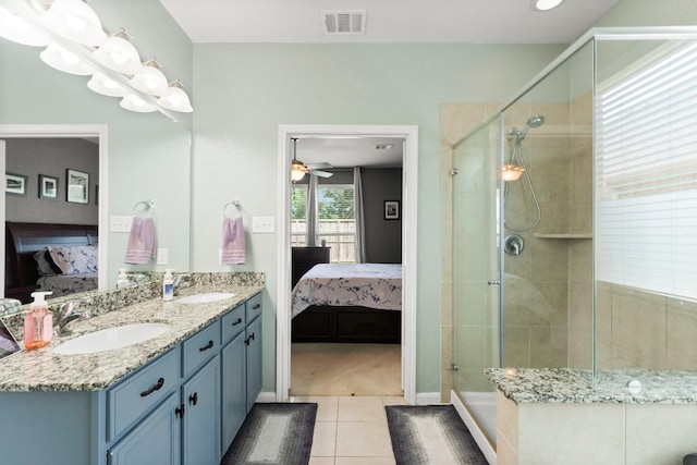 23707 Pennington Hills Dr, Spring, TX 77389 - ensuite bathroom with tile patterned floors, double vanity, a stall shower, and a ceiling fan