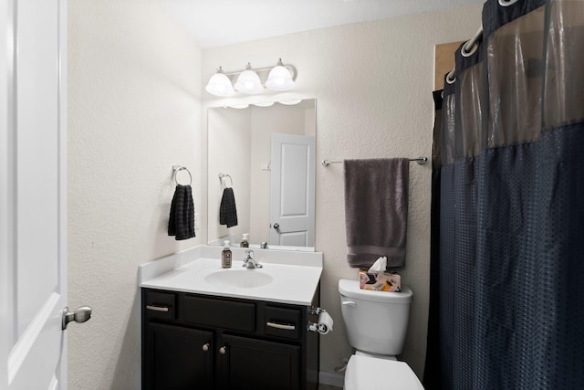 23707 Pennington Hills Dr, Spring, TX 77389 - bathroom with vanity, a textured wall, and a shower with curtain