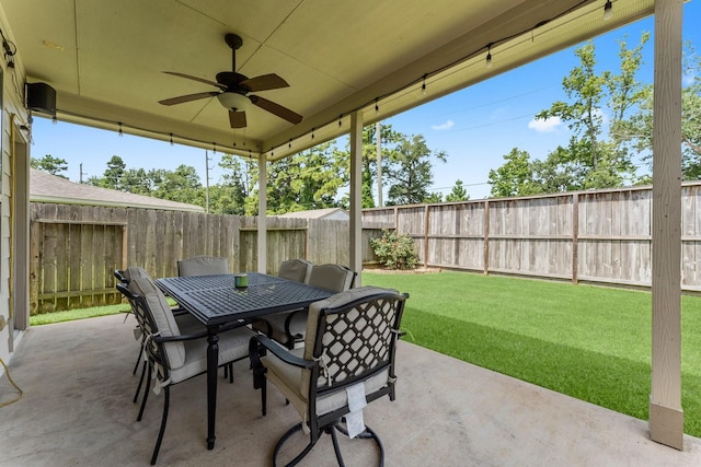 23707 Pennington Hills Dr, Spring, TX 77389 - fenced backyard with a patio area, a ceiling fan, and outdoor dining area