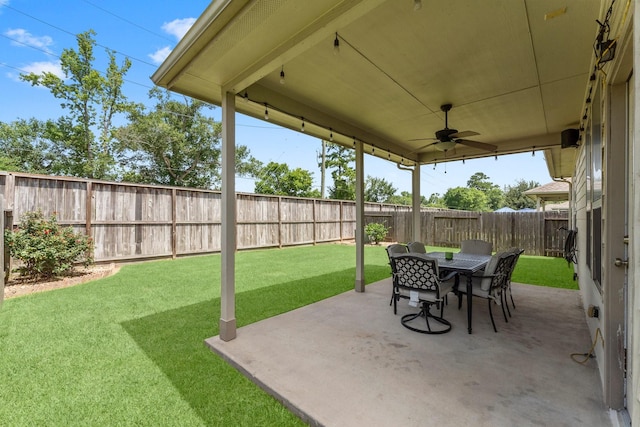 23707 Pennington Hills Dr, Spring, TX 77389 - fenced backyard with a ceiling fan, outdoor dining area, and a patio area