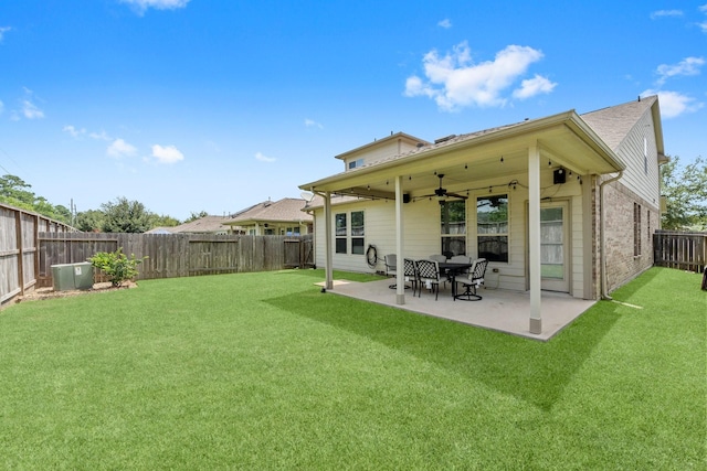 23707 Pennington Hills Dr, Spring, TX 77389 - back of house featuring ceiling fan, a fenced backyard, a patio area, and brick siding