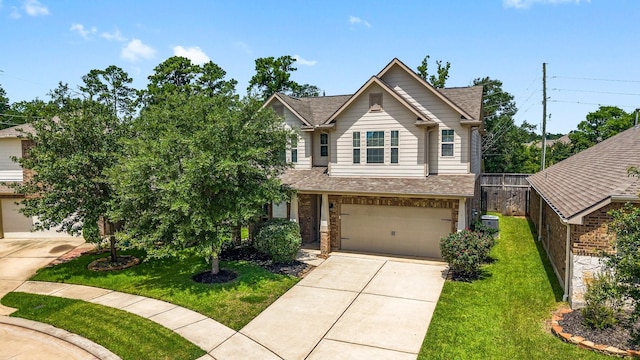 23707 Pennington Hills Dr, Spring, TX 77389 - view of front facade with concrete driveway, an attached garage, roof with shingles, and brick siding