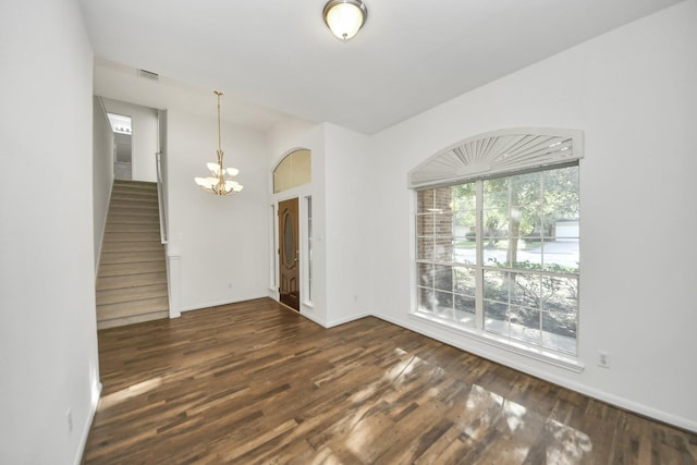 32310 Archer Park, Conroe, TX 77385 - spare room with a chandelier, dark wood-style floors, and stairway