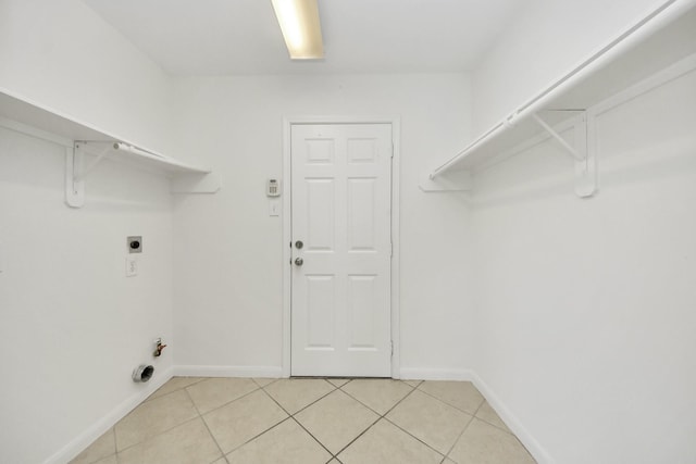 32310 Archer Park, Conroe, TX 77385 - laundry area featuring light tile patterned flooring and hookup for an electric dryer