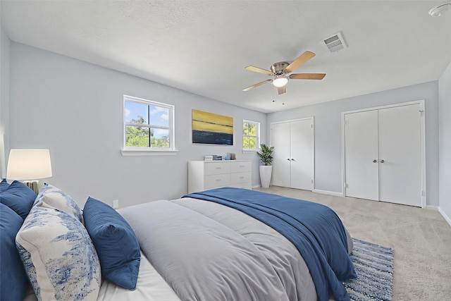 23206 Goodfellow Dr, Spring, TX 77373 - bedroom featuring two closets, carpet flooring, and a ceiling fan