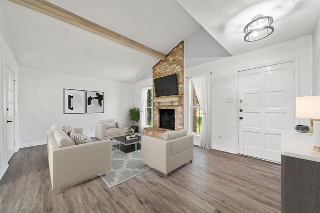 23206 Goodfellow Dr, Spring, TX 77373 - living room featuring wood finished floors and a brick fireplace