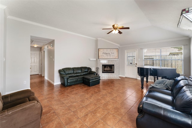 2410 Prides Crossing Rd, Houston, TX 77067 - living room featuring a ceiling fan, attic access, a tile fireplace, crown molding, and light tile patterned floors