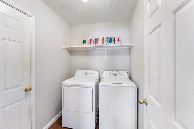 2410 Prides Crossing Rd, Houston, TX 77067 - laundry area with washing machine and dryer and a textured ceiling