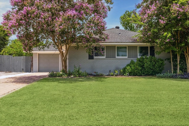 4606 Nina Lee Ln, Houston, TX 77092 - view of front of home featuring concrete driveway, a garage, brick siding, and a shingled roof