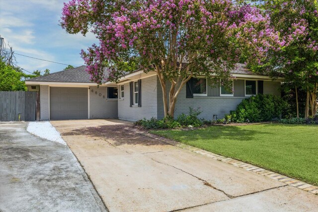 4606 Nina Lee Ln, Houston, TX 77092 - view of front facade featuring brick siding, a garage, and concrete driveway