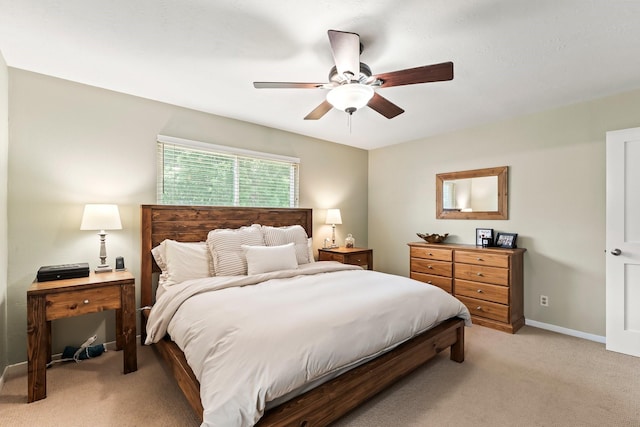 115 Heather Ln, Conroe, TX 77385 - bedroom featuring light carpet and ceiling fan