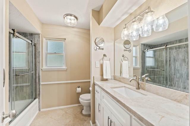 115 Heather Ln, Conroe, TX 77385 - bathroom featuring vanity, tile patterned floors, and enclosed tub / shower combo