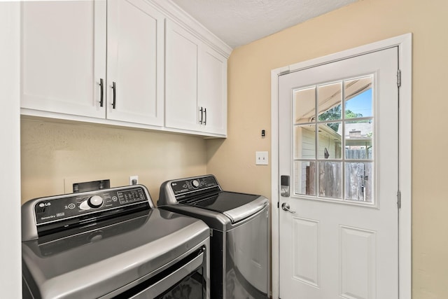 115 Heather Ln, Conroe, TX 77385 - washroom featuring cabinet space and washer and clothes dryer