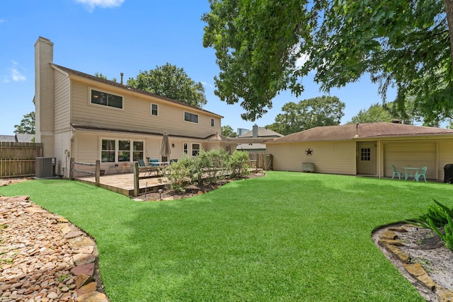 115 Heather Ln, Conroe, TX 77385 - rear view of house featuring a fenced backyard, a chimney, a patio area, and a garage