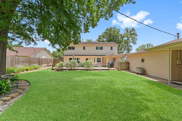 115 Heather Ln, Conroe, TX 77385 - back of property featuring a fenced backyard and a gate