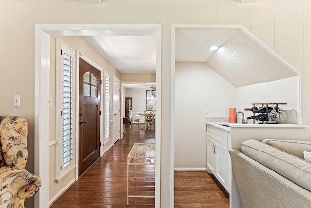 115 Heather Ln, Conroe, TX 77385 - foyer entrance featuring dark wood-style flooring and vaulted ceiling