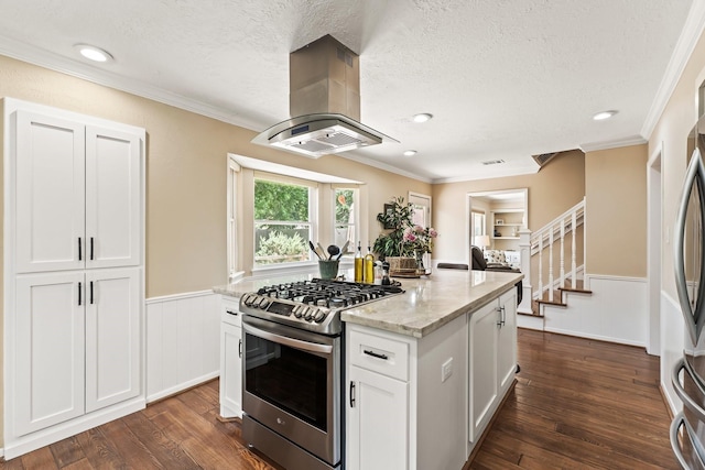 115 Heather Ln, Conroe, TX 77385 - kitchen featuring stainless steel gas range oven, island exhaust hood, dark wood-type flooring, light stone counters, and a textured ceiling