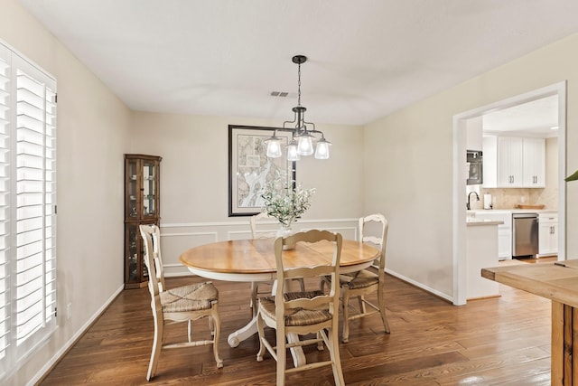115 Heather Ln, Conroe, TX 77385 - dining area featuring wood finished floors and baseboards