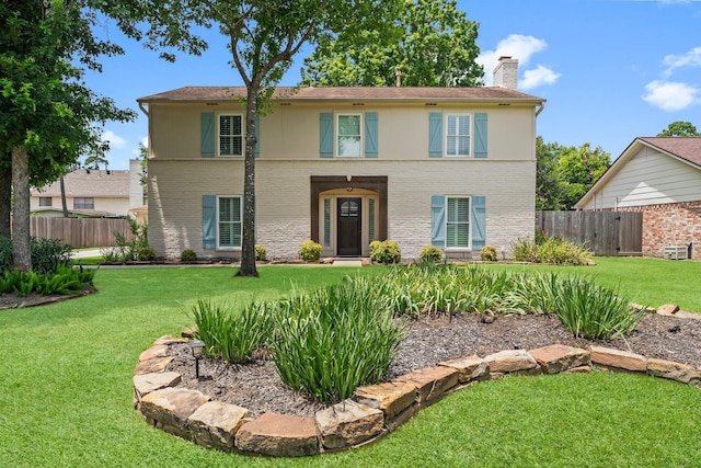 115 Heather Ln, Conroe, TX 77385 - view of front facade with a chimney and brick siding