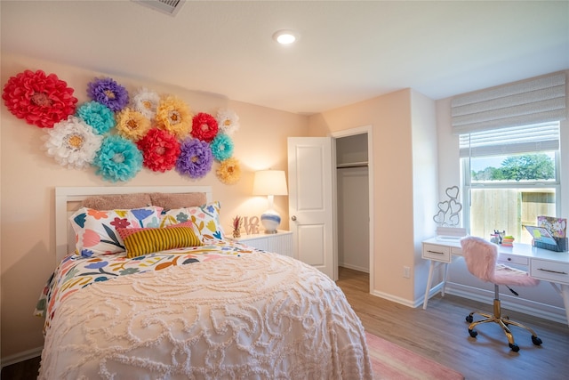 10808 Red Orchid Dr, Houston, TX 77016 - bedroom with wood finished floors and an office area