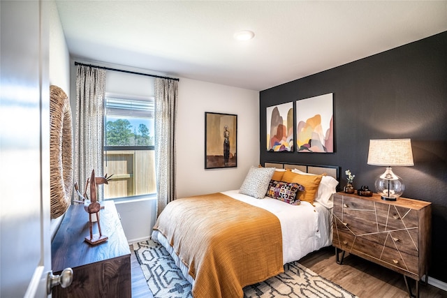 10808 Red Orchid Dr, Houston, TX 77016 - bedroom with wood finished floors and baseboards