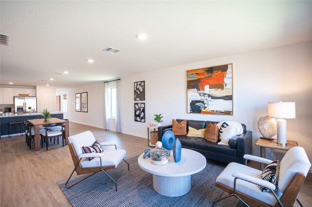 10808 Red Orchid Dr, Houston, TX 77016 - living area with light wood-type flooring and recessed lighting