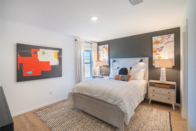 10808 Red Orchid Dr, Houston, TX 77016 - bedroom with wood finished floors and recessed lighting