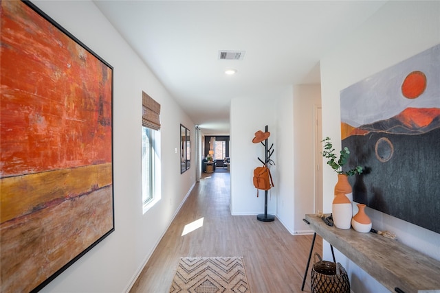 10808 Red Orchid Dr, Houston, TX 77016 - hallway featuring light wood-style floors and recessed lighting