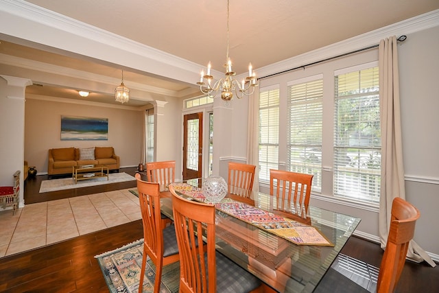 806 Spring Mist Ct, Sugar Land, TX 77479 - dining area with ornamental molding, dark wood finished floors, a chandelier, and plenty of natural light