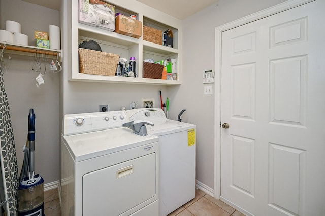 806 Spring Mist Ct, Sugar Land, TX 77479 - laundry area featuring washer and dryer and light tile patterned floors