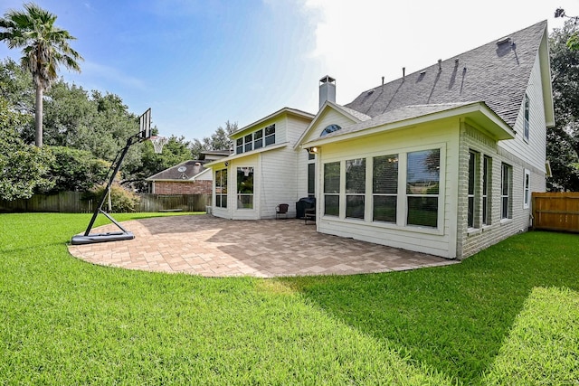 806 Spring Mist Ct, Sugar Land, TX 77479 - rear view of property featuring a fenced backyard, roof with shingles, a chimney, and a patio area
