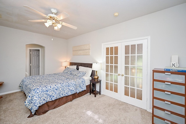 806 Spring Mist Ct, Sugar Land, TX 77479 - bedroom featuring french doors, carpet, arched walkways, and a ceiling fan