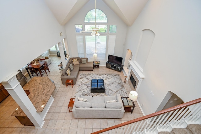 806 Spring Mist Ct, Sugar Land, TX 77479 - tiled living room with high vaulted ceiling and stairway