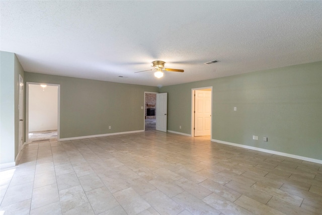 15823 Stagecoach Rd, Stagecoach, TX 77355 - unfurnished room with ceiling fan and a textured ceiling